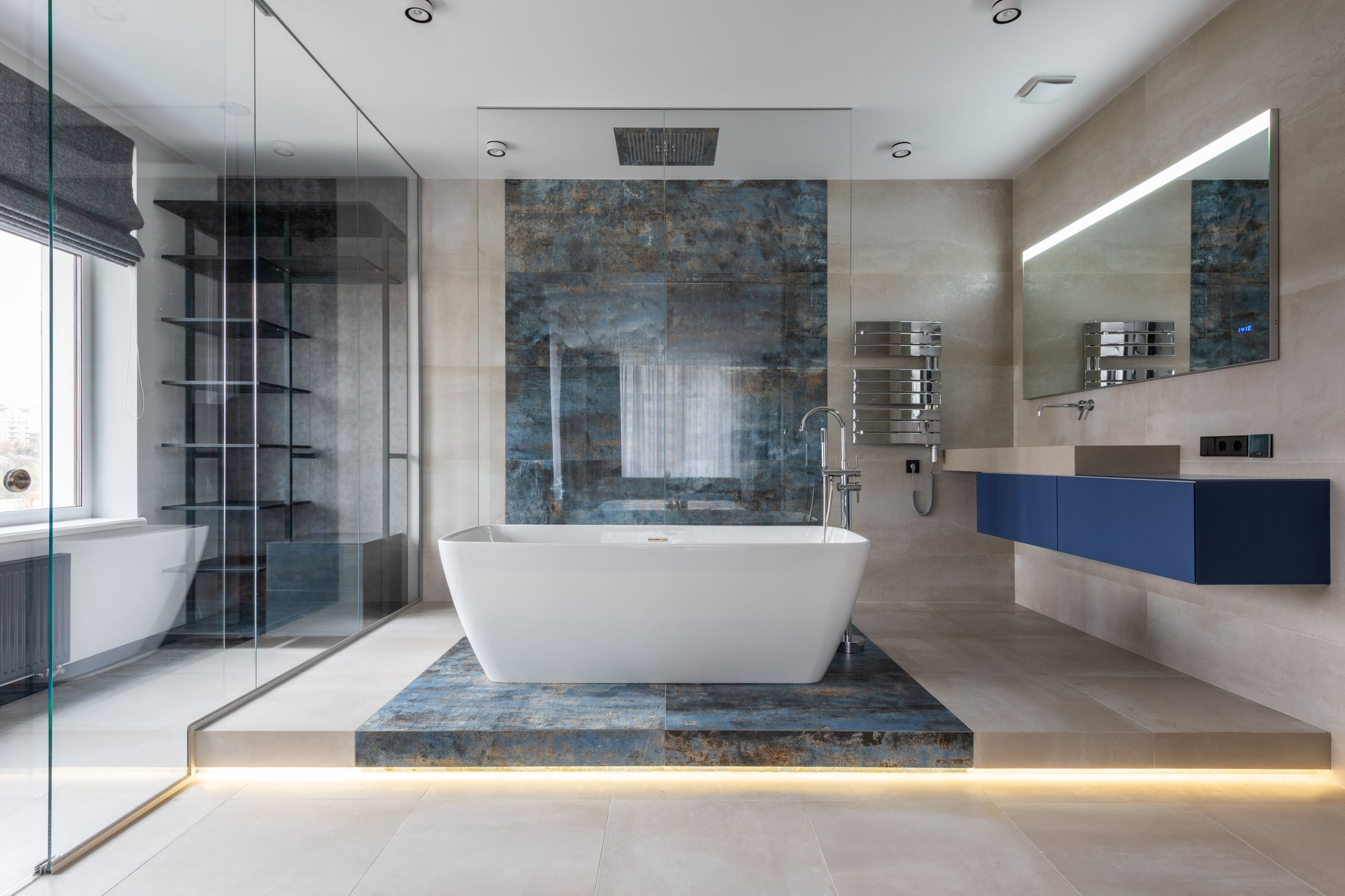 Freestanding bathtub and calming bathroom finishes